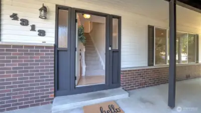 Charming front entry sets the tone for a warm and inviting home.