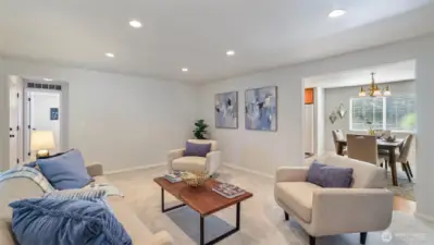 The open layout connects the sitting room to the dining space with ease.