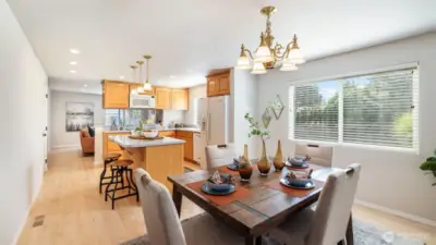 Open-concept kitchen and dining area filled with natural light.