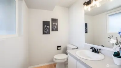 Well-appointed powder room with fresh, modern details.