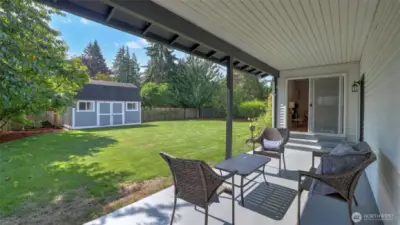 Relax on the covered patio while overlooking your spacious backyard retreat.Relax on the covered patio while overlooking your spacious backyard retreat.