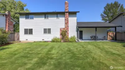 Enjoy the seamless indoor-outdoor lifestyle with this generous backyard and covered patio space.