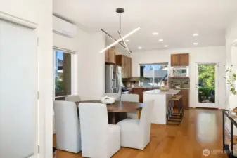 Sophisticated dining space with contemporary lighting fixtures.