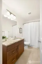 Ample storage, beautiful tiling, all in this spacious guest bath!