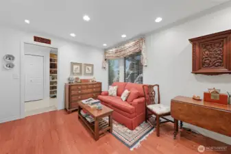 Cozy family/TV room off the entry & adjacent to kitchen.