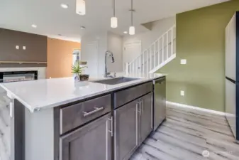 Kitchen looks out to living room