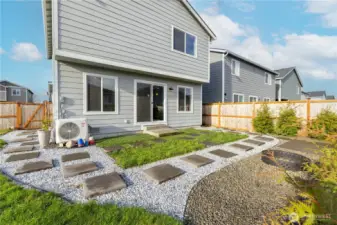 Nicely landscaped yard with gate