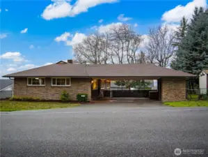 The connected carport allows for two vehicle to park under cover.