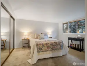 The larger of the two bedrooms, primary bedroom, has mirrored closet doors that makes the space feel larger.