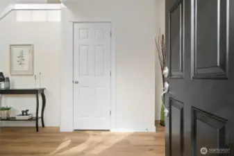 Entry Hall with soaring ceilings, brand new flooring & fresh paint await you!