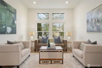 Tall ceilings and dimmer canned lighting make this living room a quiet space to entertain.