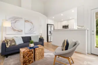 Open concept kitchen with rec room and tall ceilings through-out main level.