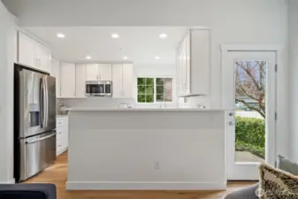 Breakfast bar with brand new quartz counters, all new appliances, electrical and new soft close cabinets!