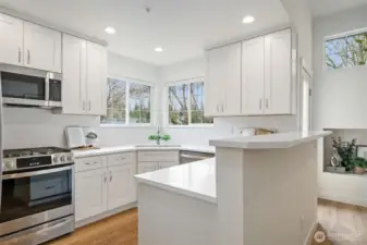 Fresh 'to the studs' kitchen - quality choices in cabinets, counters, appliances & tile.