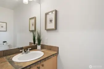 Half Bath on main level - new floors, toilet and lighting.