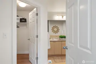 Enter the Main Level Primary Suite - All new flooring, paint, lighting, toilet and walk in closet.