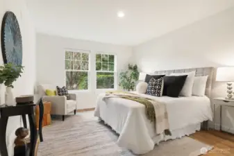 Main level primary bedroom with brand new flooring, blinds, fresh paint and canned lights.