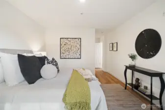 Primary on main looking toward the en-suite bathroom & walk in closet.