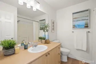 2nd level full hall bathroom with bathtub and new toilet.