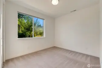 Main level bedroom with closet