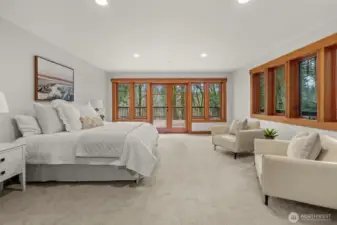 Primary suite with large windows and natural light