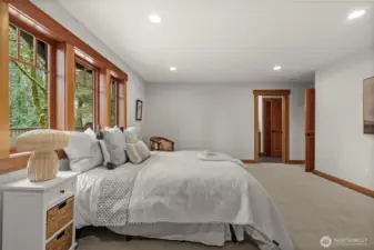 Additional bedroom with large windows and a quiet setting