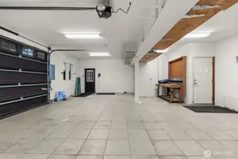 Oversized 2-car garage with ample storage and workspace