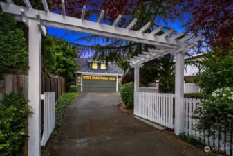 This gate can be closed and the back yard is totally fenced- you see the detached two garage and then there is a studio (heated) extra space for an office, work out room or an artist studio.....