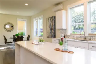 kitchen windows overlooking the private backyard and patio