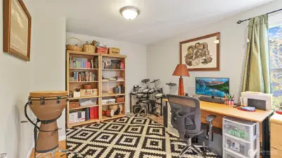 Guest room upstairs ready to fit your needs—whether it’s a quiet workspace, creative studio, or cozy reading nook.