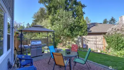 Step out onto the back patio- ideal for gatherings, barbeques, and outdoor entertainment