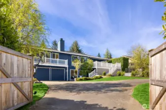 Gated entry to 2 car garage and additional parking