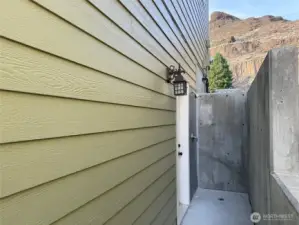 Outdoor shower located just outside of lower floor bathroom with view of basalt cliffs