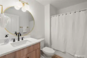 Full bath near two bedrooms features brand new European bath vanity with quartz counter. New faucet, mirror, light fixtures and towel hardware.