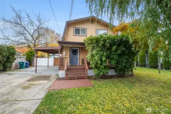 Charming curb appeal with a country feel—level lot with fruit trees and fully fenced yard.