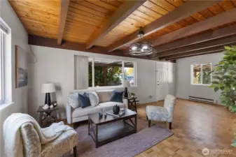 Open-concept living area seamlessly flows into dining and kitchen spaces.