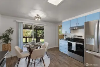 Sunlit kitchen with a fresh, modern color palette and backyard views—ideal for everyday living or entertaining.