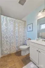 Private bath in the primary suite—stylish and well-maintained.