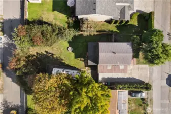 Aerial view of home and lot layout showcasing ample outdoor space.