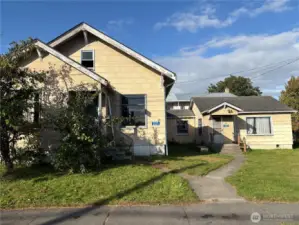 Smaller structure on the right is 221 S Cherry. This one is in better shape and was used the last few years by the owner.