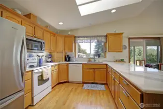 Chef's kitchen with granite countertops and tons of storage.