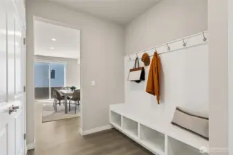 Incredible drop zone as you come in from the garage for groceries, bags and coats after plugging into your electric vehicle charging outlet. Photo's are for representational purposes only. Colors and finishes may differ.