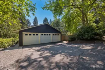 A 21st Century 3-car garage!  Room for the cars, sports gear, or use one bay as a work-out area!