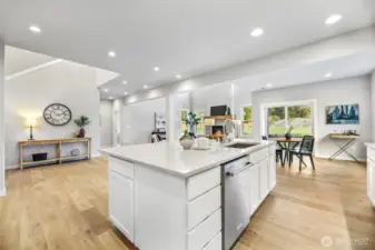 Kitchen looking to nook and 2-story family room