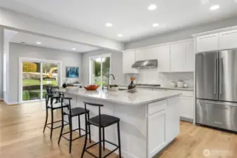 Kitchen with oversized island Kitchen Aid appliances and Bonus Stainless Refrigerator