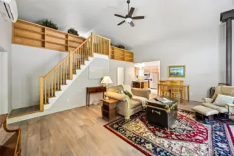 2nd Home - Large living room with high ceilings and a view of the loft.