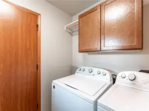 Laundry with storage cabinets