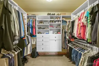 Primary bedroom walk in closet
