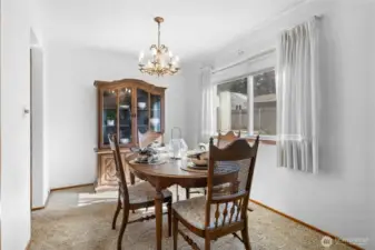 Dining room has hardwood floors under carpet