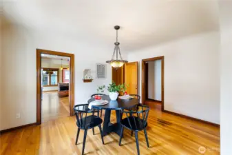 Formal dining between kitchen and formal living room.